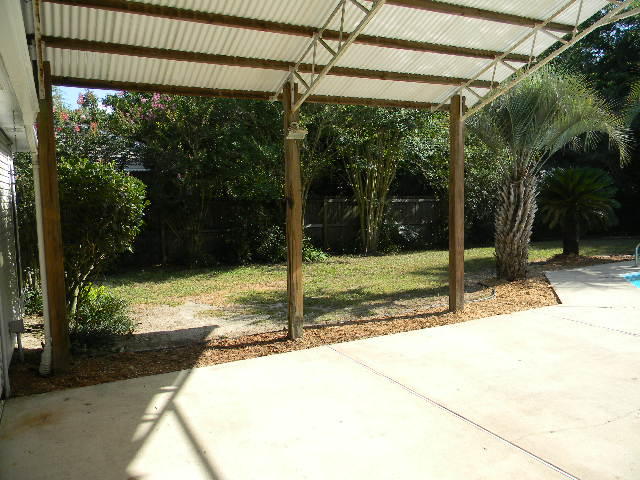 2844 Old Mill Way Crestview, FL 32539 - Photo 44 of 49 a view of a backyard with a garden
