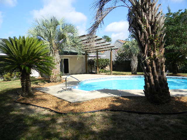 2844 Old Mill Way Crestview, FL 32539 - Photo 49 of 49 a view of a house with swimming pool and sitting area