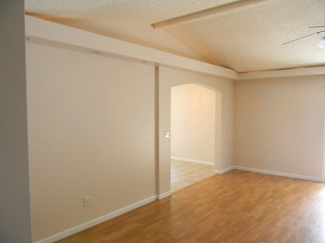 2844 Old Mill Way Crestview, FL 32539 - Photo 8 of 49 an empty room with wooden floor and windows