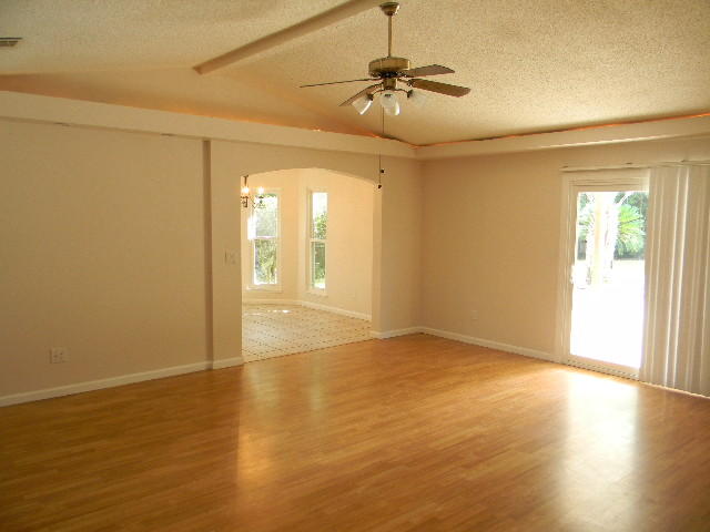 2844 Old Mill Way Crestview, FL 32539 - Photo 10 of 49 a view of an empty room with wooden floor and a window