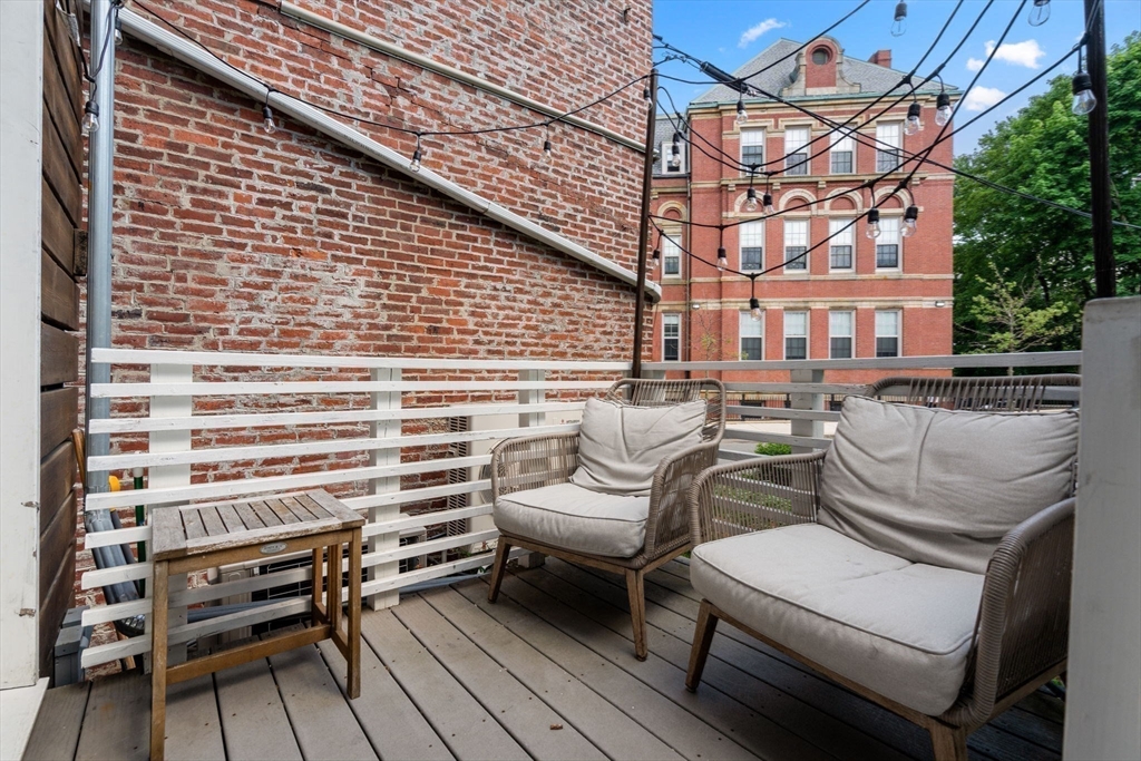 67 Dudley Street, Unit SF Boston, MA 02119 - Photo 15 of 28 a view of a patio with couches and pool