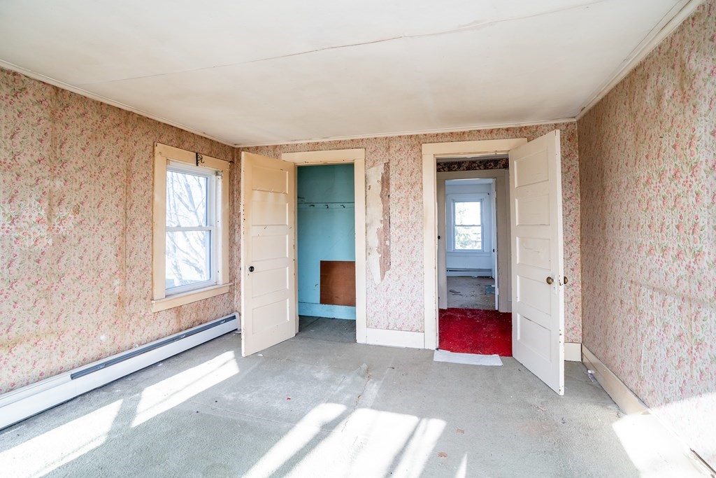 2049 Pleasant Street Three Rivers, MA 01080 - Photo 18 of 19 a view of an empty room with closet and a window