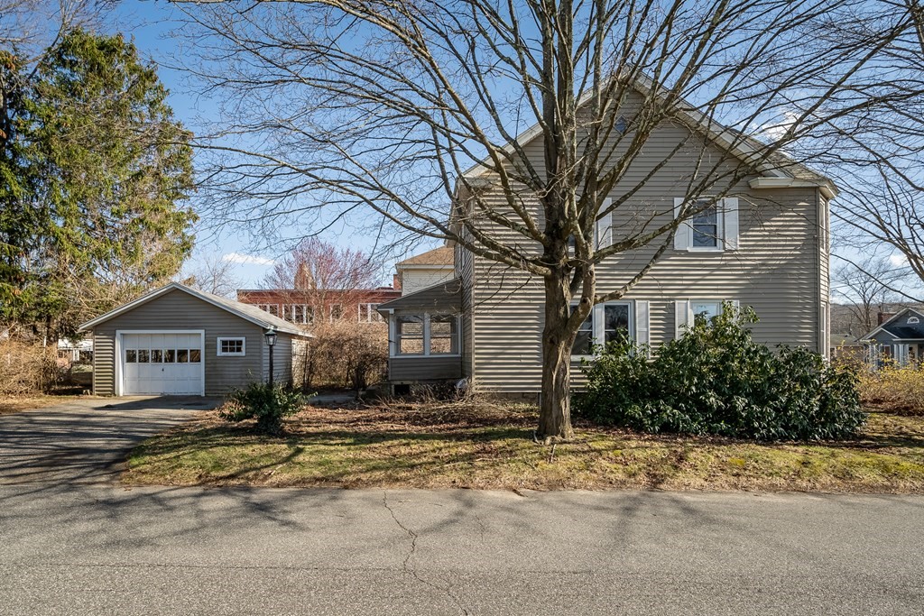 2049 Pleasant Street Three Rivers, MA 01080 - Photo 4 of 19 a front view of a house with a yard