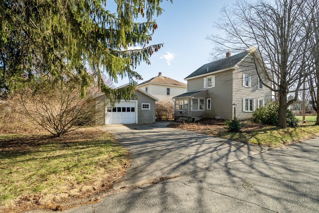 2049 Pleasant Street Three Rivers, MA 01080 - Photo 5 of 19 a front view of a house with a yard