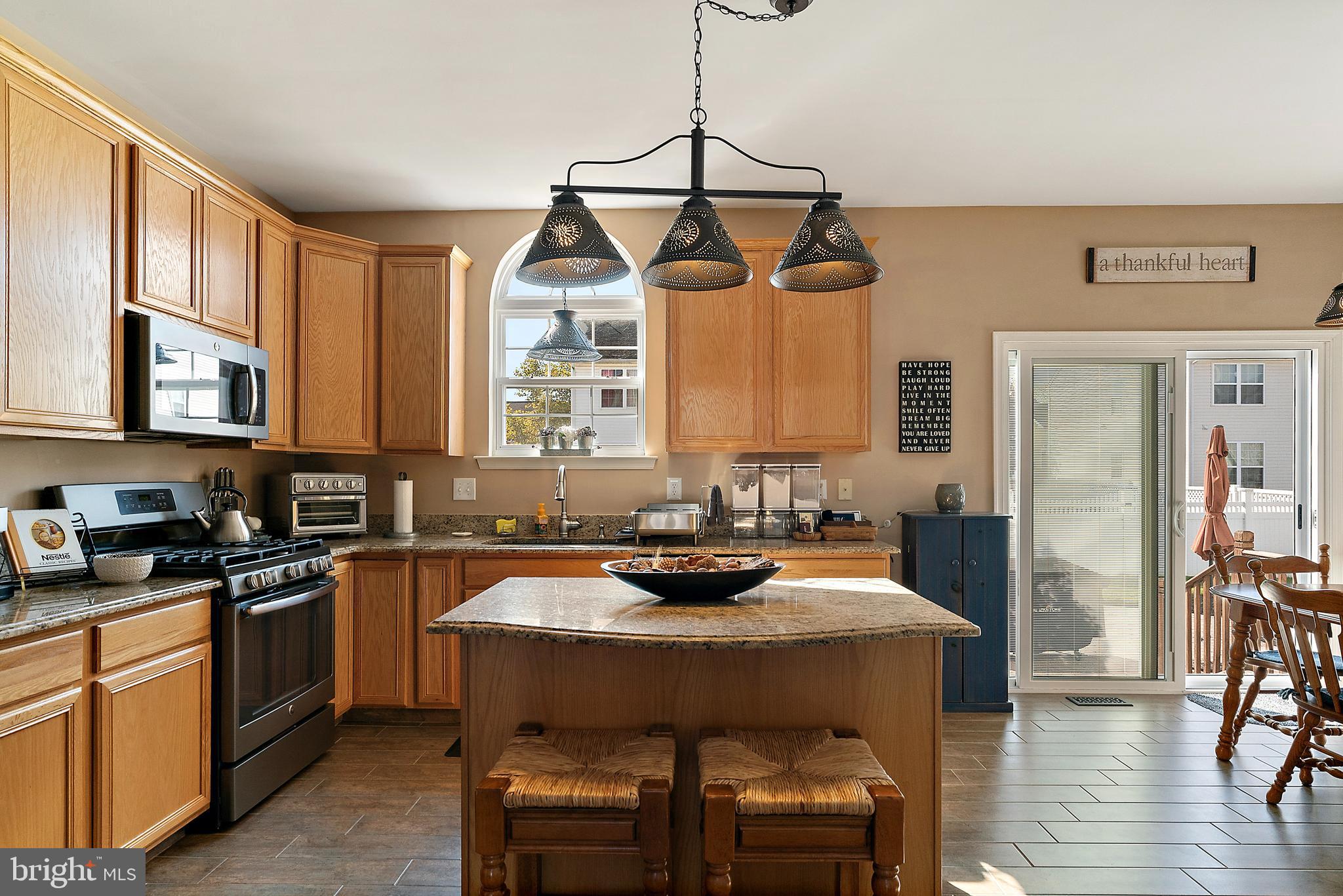 4 Midfield Street Sicklerville, NJ 08081 - Photo 11 of 40 a kitchen with a sink stove and wooden floor