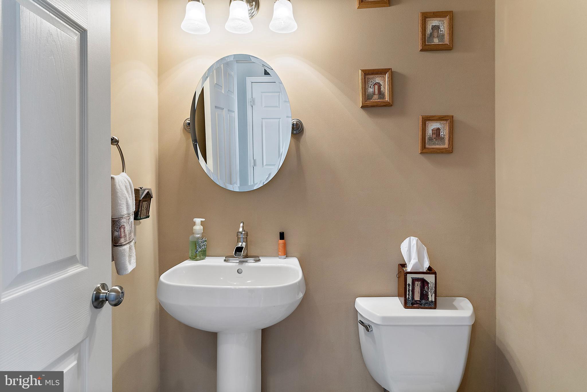 4 Midfield Street Sicklerville, NJ 08081 - Photo 14 of 40 a bathroom with a toilet a sink and a mirror