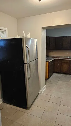 a kitchen with a cabinets and steel appliances