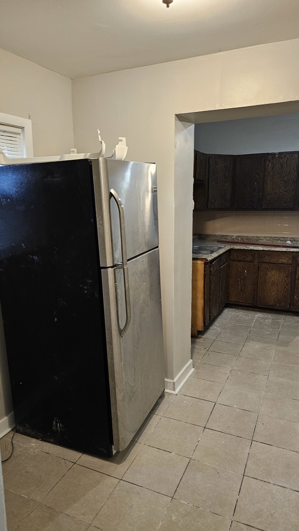 7839 South Loomis Boulevard, Unit 1 Chicago, IL 60620 - Photo 3 of 10 a kitchen with a cabinets and steel appliances