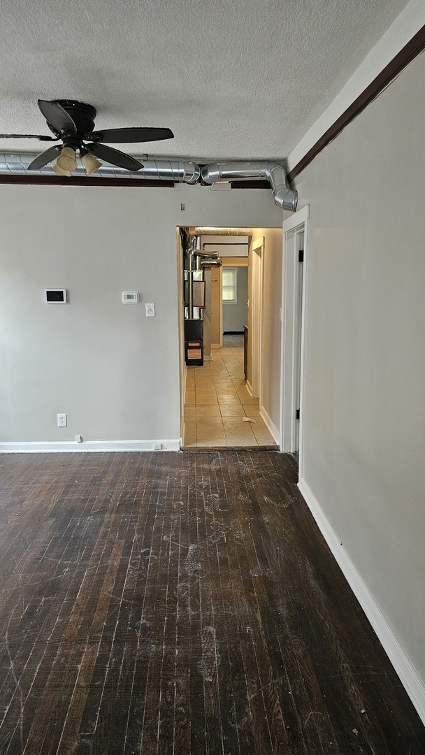 7839 South Loomis Boulevard, Unit 1 Chicago, IL 60620 - Photo 9 of 10 a view of a hallway with wooden floor