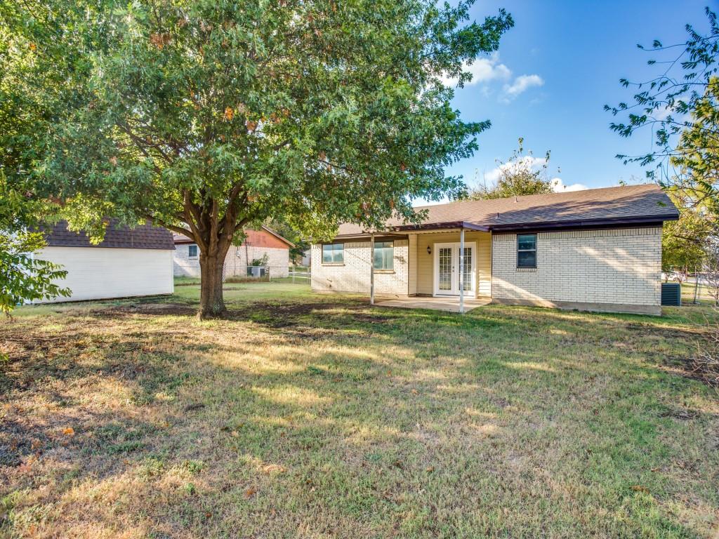 301 Springwillow Road Burleson, TX 76028 - Photo 12 of 12 Rear view of property featuring brick siding, a patio area, and french doors