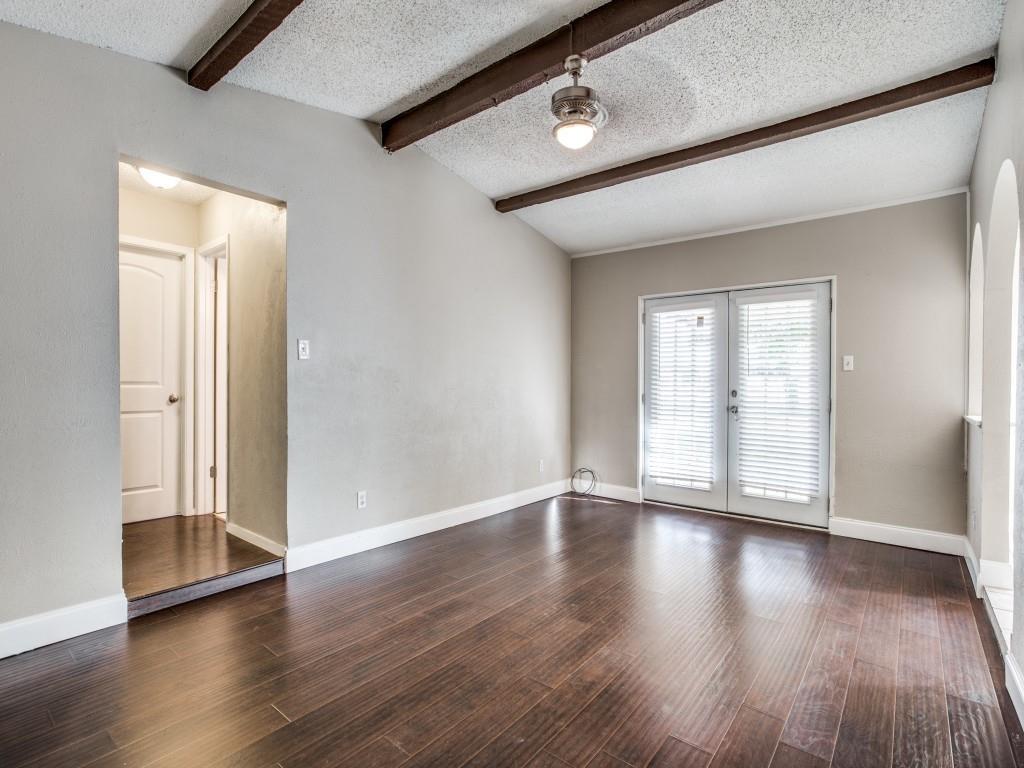 301 Springwillow Road Burleson, TX 76028 - Photo 2 of 12 Empty room with a textured ceiling, dark wood finished floors, and french doors