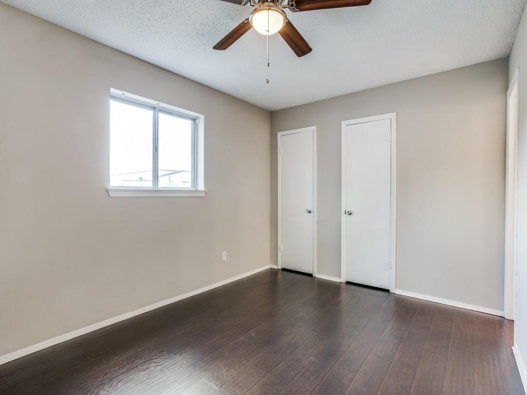 301 Springwillow Road Burleson, TX 76028 - Photo 5 of 12 Kitchen with appliances with stainless steel finishes, a textured ceiling, pendant lighting, light stone countertops, and light tile patterned flooring