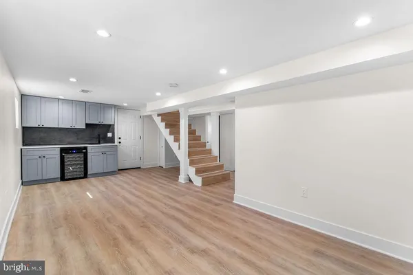 a view of kitchen with wooden floor electronic appliances and window