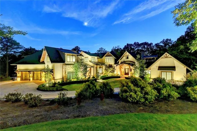 a view of a dining room with furniture wooden floor and a chandelier