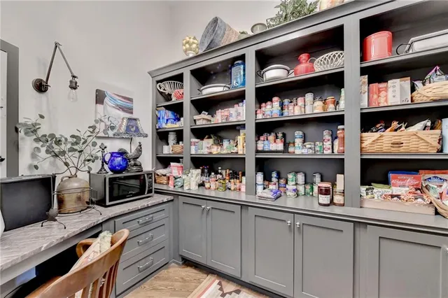 an aerial view of a house with a yard and swimming pool
