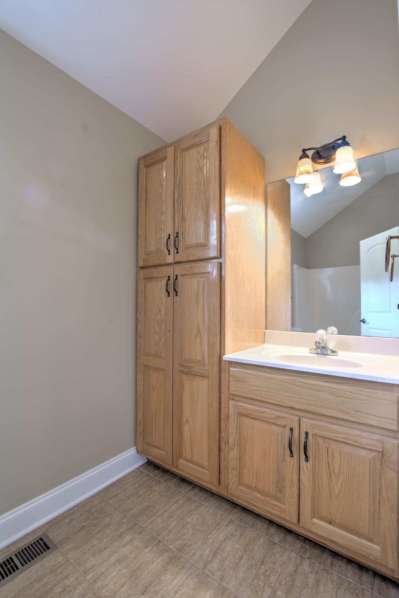 169 Lanes Bluff Road Clinton, TN 37716 - Photo 20 of 29 a bathroom with a double vanity sink and mirror