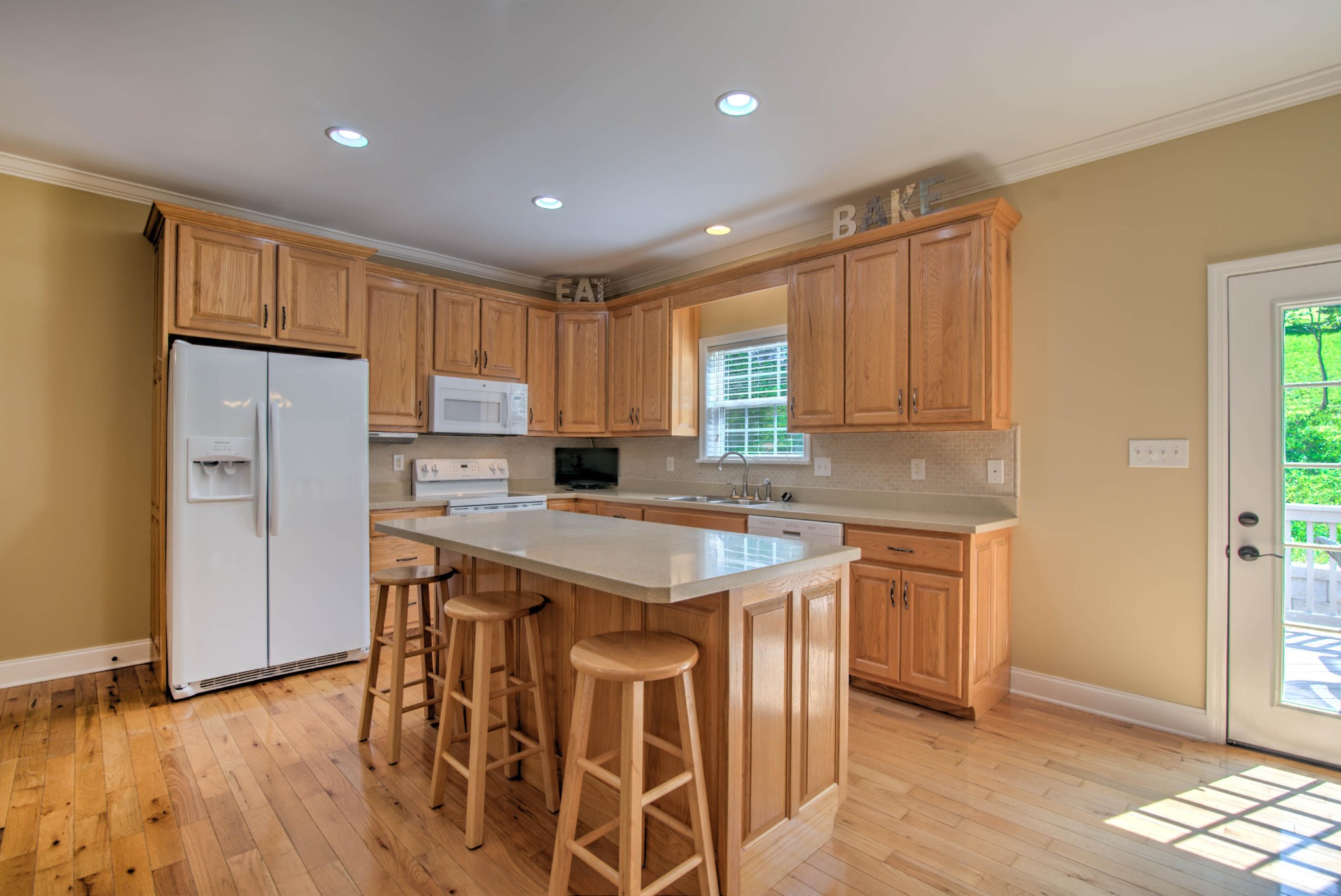 169 Lanes Bluff Road Clinton, TN 37716 - Photo 8 of 29 a kitchen with stainless steel appliances granite countertop a refrigerator a sink dishwasher a stove and a refrigerator with wooden floor