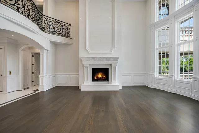 a bathroom with a sink double vanity granite tub shower and a mirror