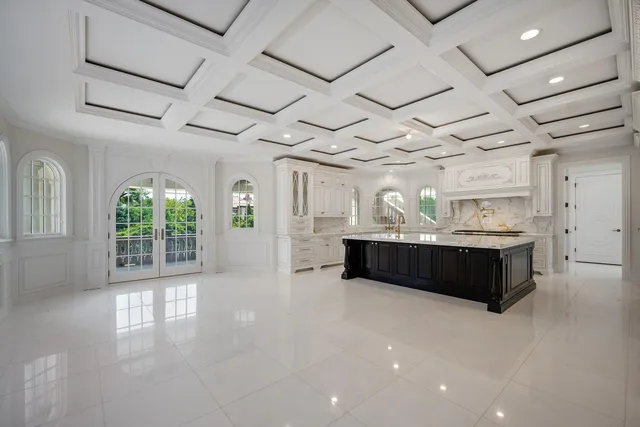 a kitchen with granite countertop a stove and a wooden cabinets