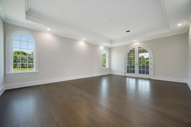 a spacious bathroom with a granite countertop tub sink and mirror