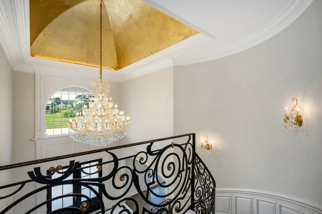 an empty room with wooden floor and a window
