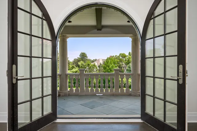 a spacious bathroom with double vanity a mirror a bathtub and a sink