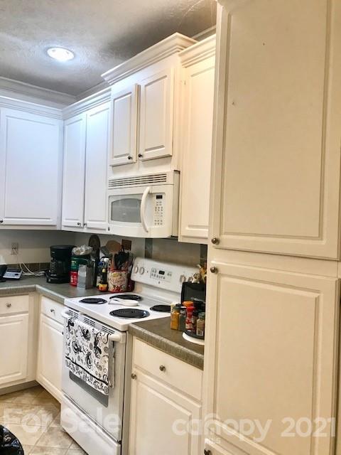 352 Pamela Road York, SC 29745 - Photo 5 of 21 a kitchen with stainless steel appliances granite countertop a stove a sink and white cabinets
