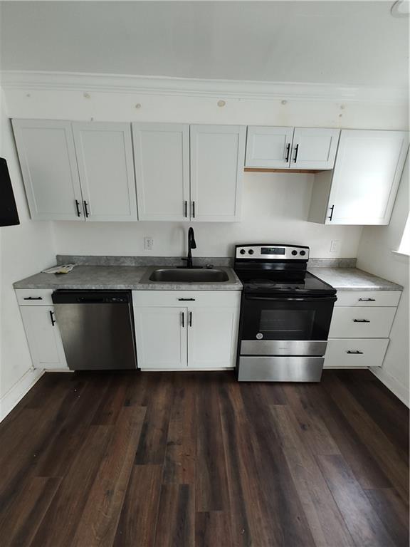 1625 Conley Road, Unit 82 Conley, GA 30288 - Photo 12 of 13 a kitchen with wooden floors and appliances