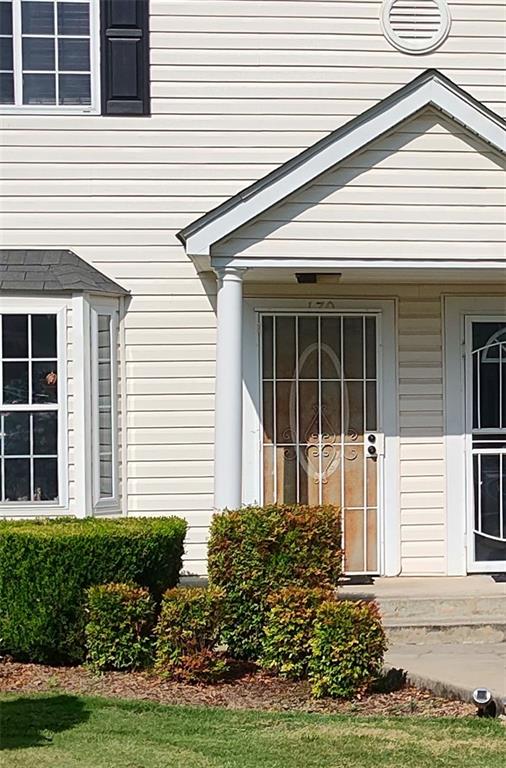 1625 Conley Road, Unit 82 Conley, GA 30288 - Photo 13 of 13 a front view of a house with a yard