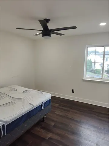 a room with a bed and a window