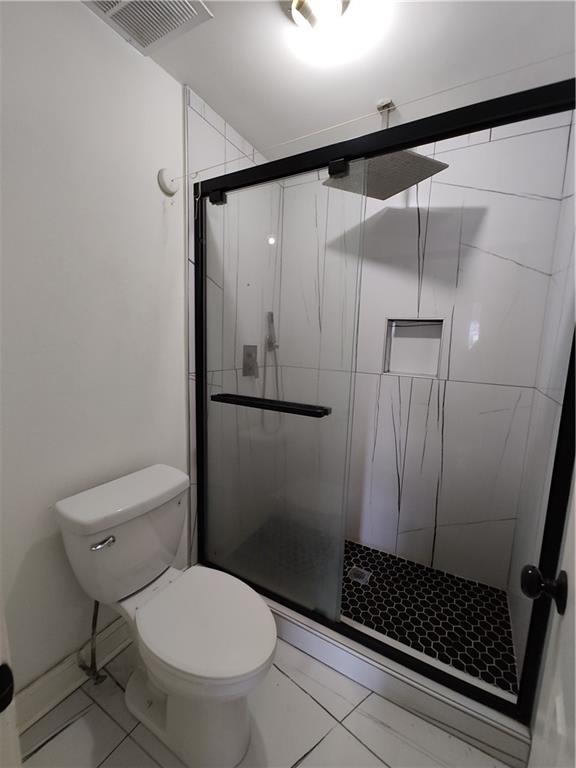 1625 Conley Road, Unit 82 Conley, GA 30288 - Photo 9 of 13 a bathroom with a toilet and a shower