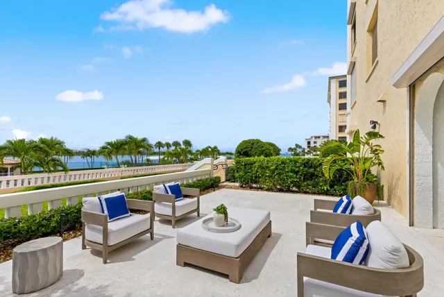 a view of house with outdoor seating and city view
