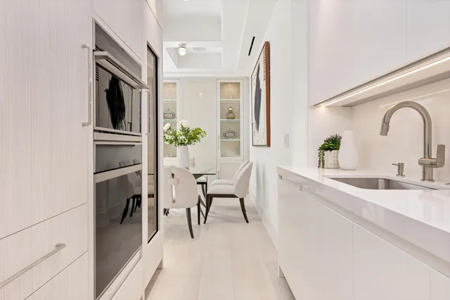 a bathroom with a double vanity sink mirror and