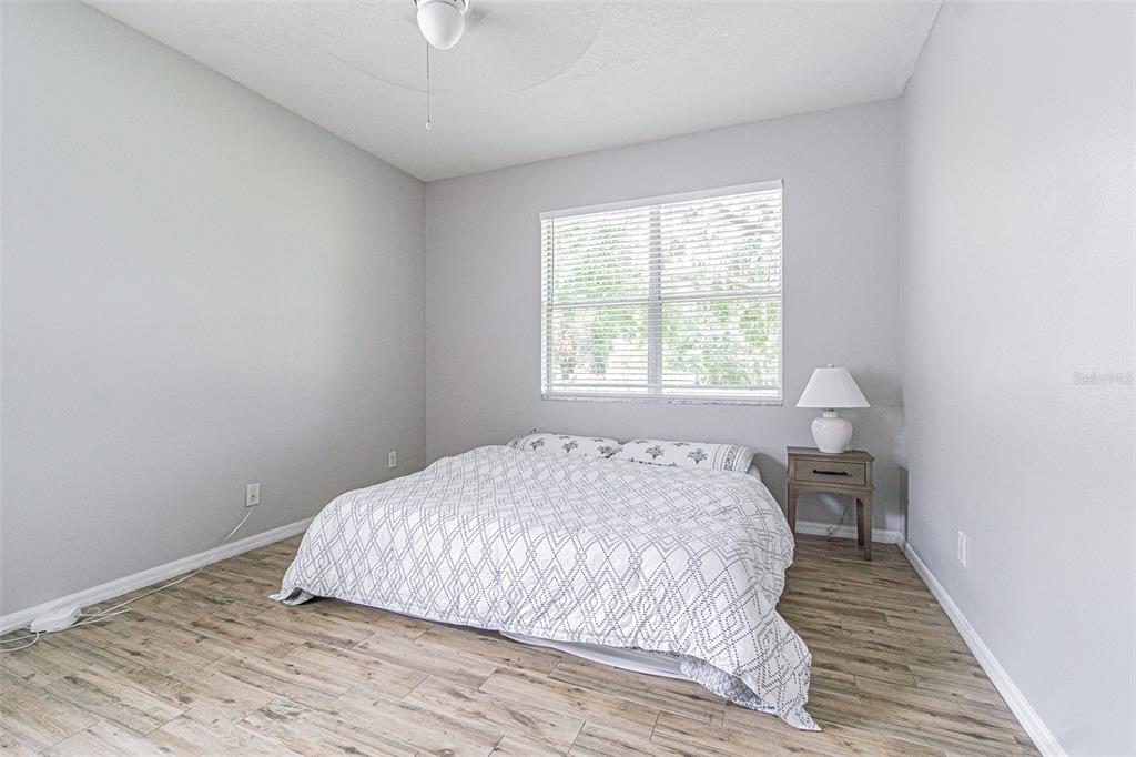 13016 Terrace Brook Place Temple Terrace, FL 33637 - Photo 11 of 27 a bedroom with a bed and a window