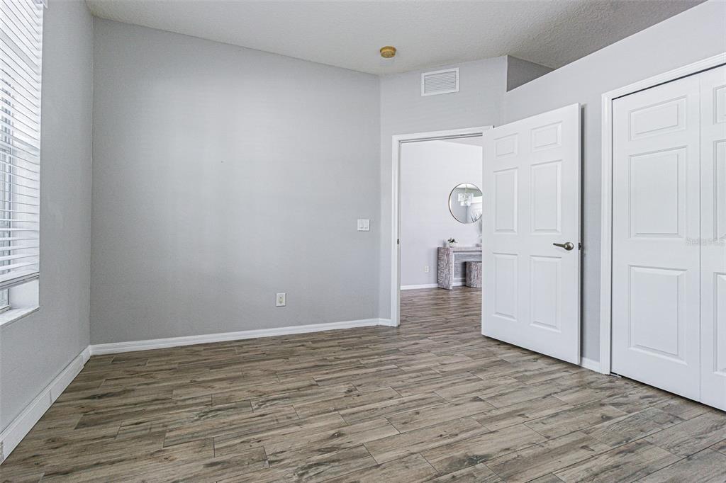 13016 Terrace Brook Place Temple Terrace, FL 33637 - Photo 12 of 27 a view of wooden floor in an empty room