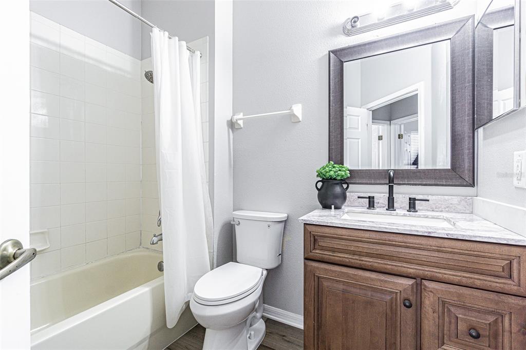 13016 Terrace Brook Place Temple Terrace, FL 33637 - Photo 16 of 27 a bathroom with a sink toilet and shower