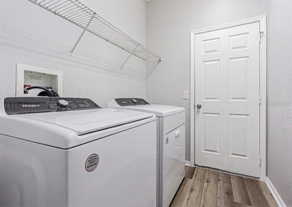 13016 Terrace Brook Place Temple Terrace, FL 33637 - Photo 17 of 27 a utility room with dryer and washer