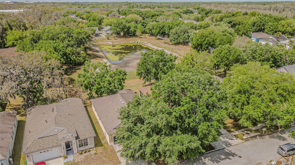 13016 Terrace Brook Place Temple Terrace, FL 33637 - Photo 20 of 27 an aerial view of residential house with outdoor space and trees all around