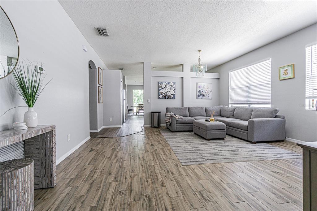 13016 Terrace Brook Place Temple Terrace, FL 33637 - Photo 2 of 27 a living room with furniture and a large window