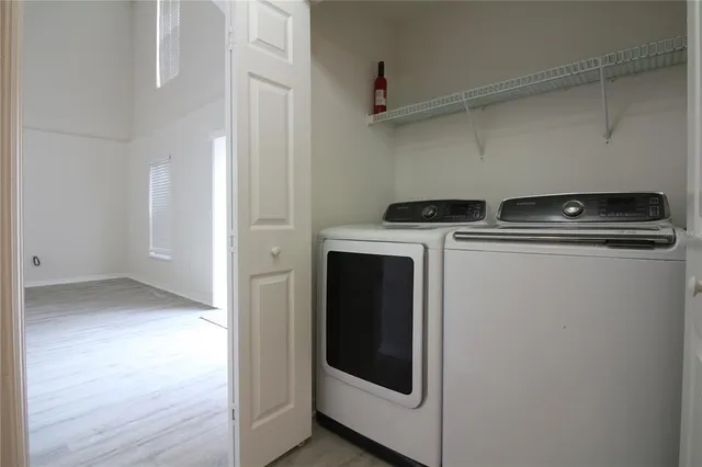 a utility room with dryer and washer