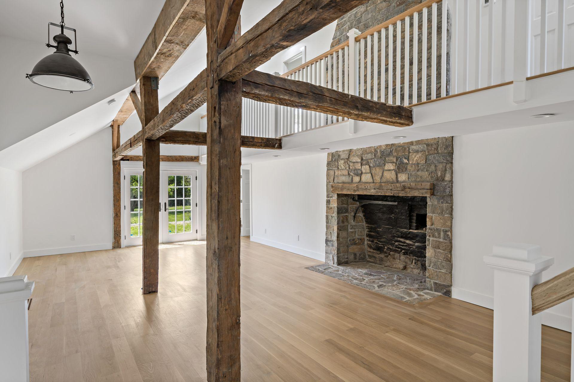 129 Davenport Ridge Road Stamford, CT 06903 - Photo 1 of 43 wooden floor in an empty room with a fireplace