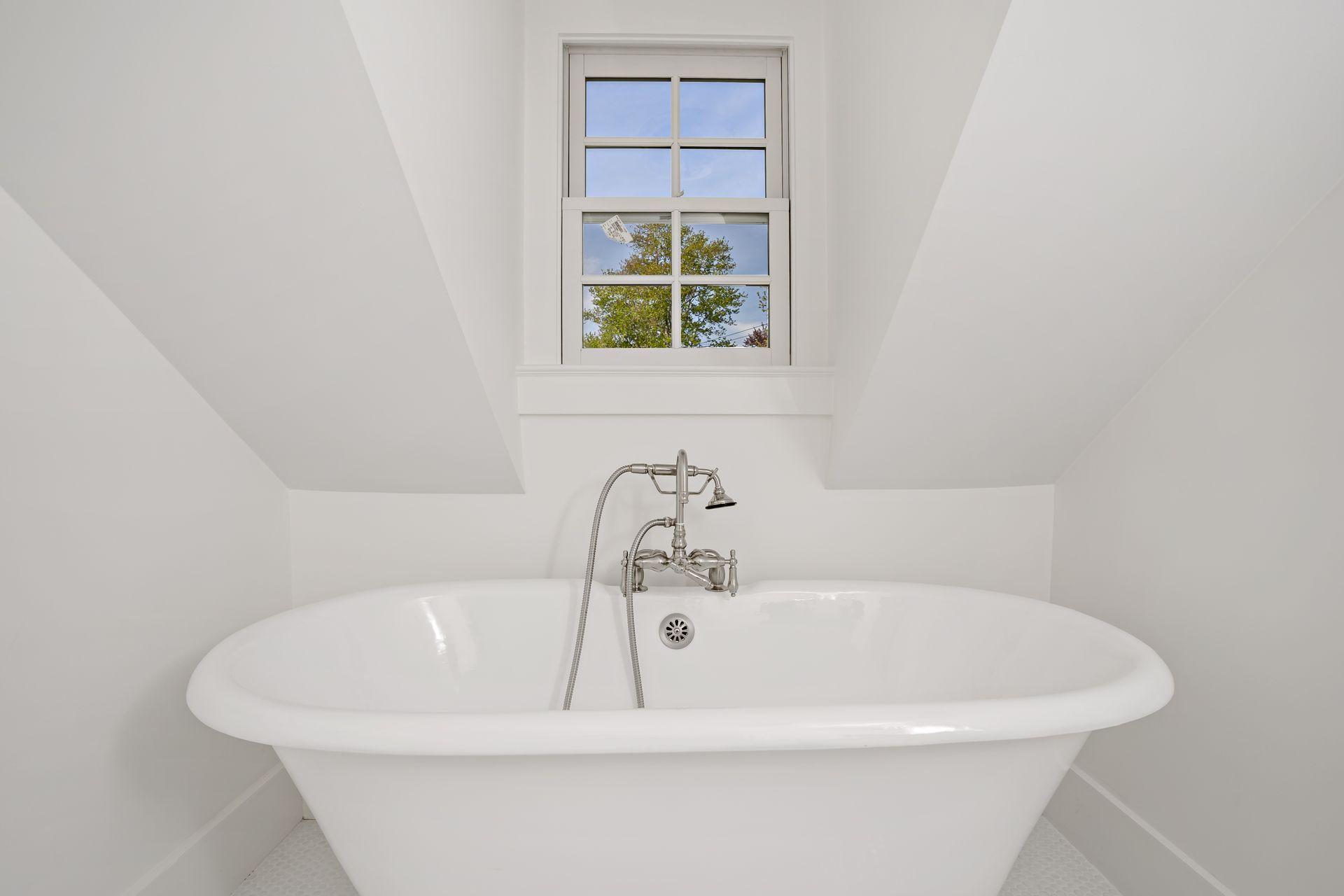 129 Davenport Ridge Road Stamford, CT 06903 - Photo 11 of 43 a white bath tub sitting in a bathroom