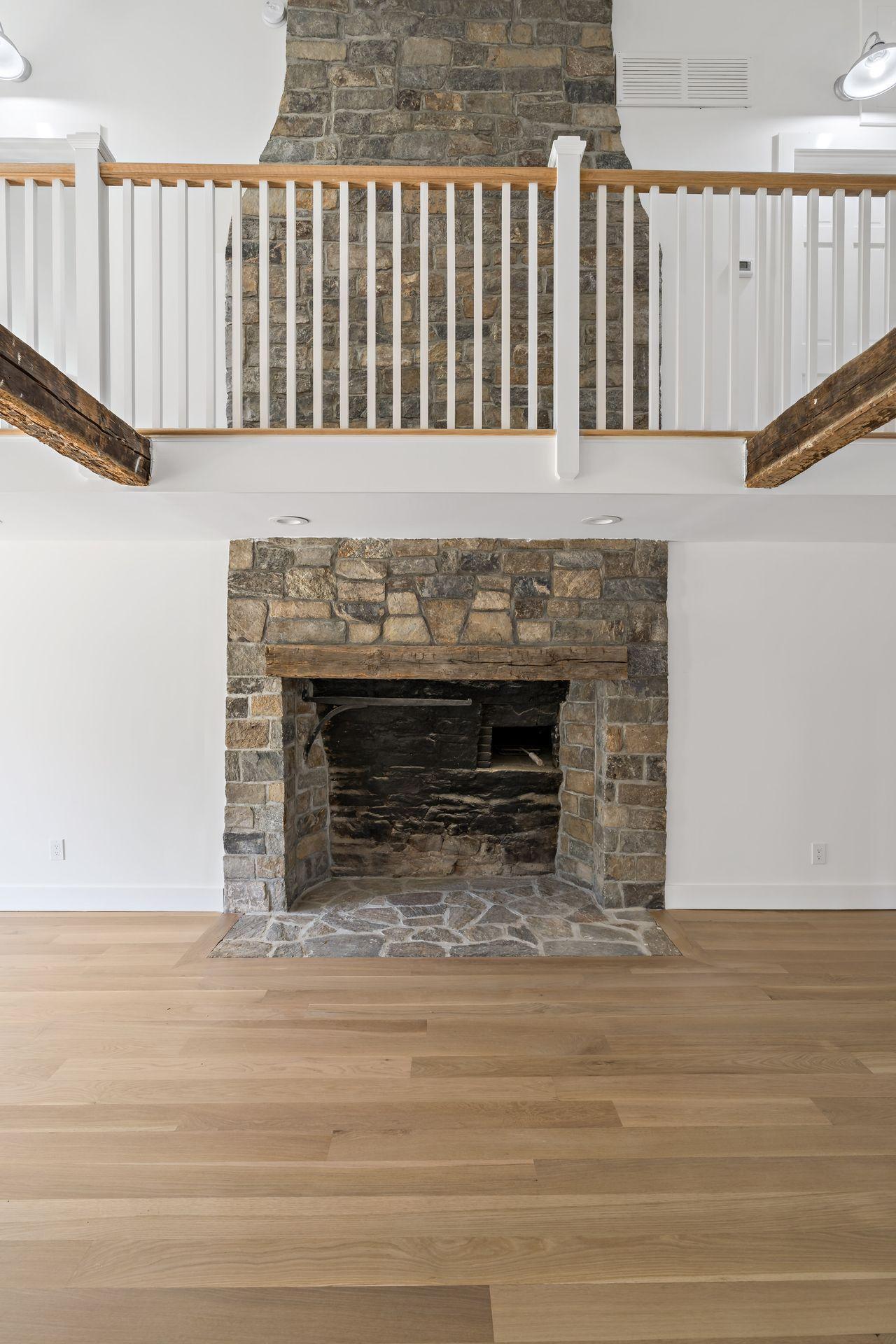129 Davenport Ridge Road Stamford, CT 06903 - Photo 17 of 43 a view of fireplace and wooden floor