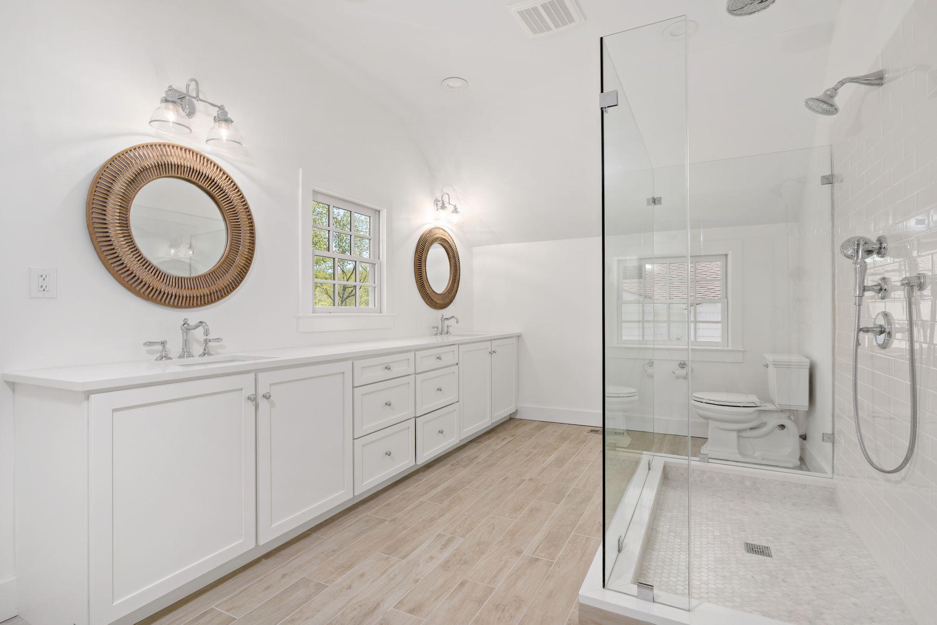 129 Davenport Ridge Road Stamford, CT 06903 - Photo 19 of 43 a spacious bathroom with a granite countertop sink mirror vanity and toilet