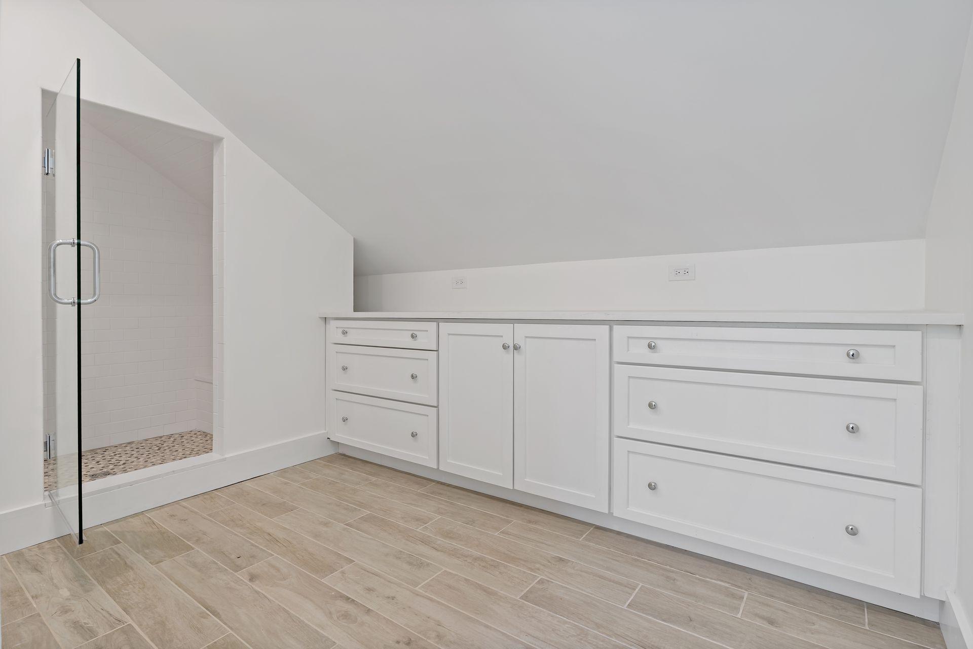 129 Davenport Ridge Road Stamford, CT 06903 - Photo 30 of 43 a view of a kitchen with white cabinets