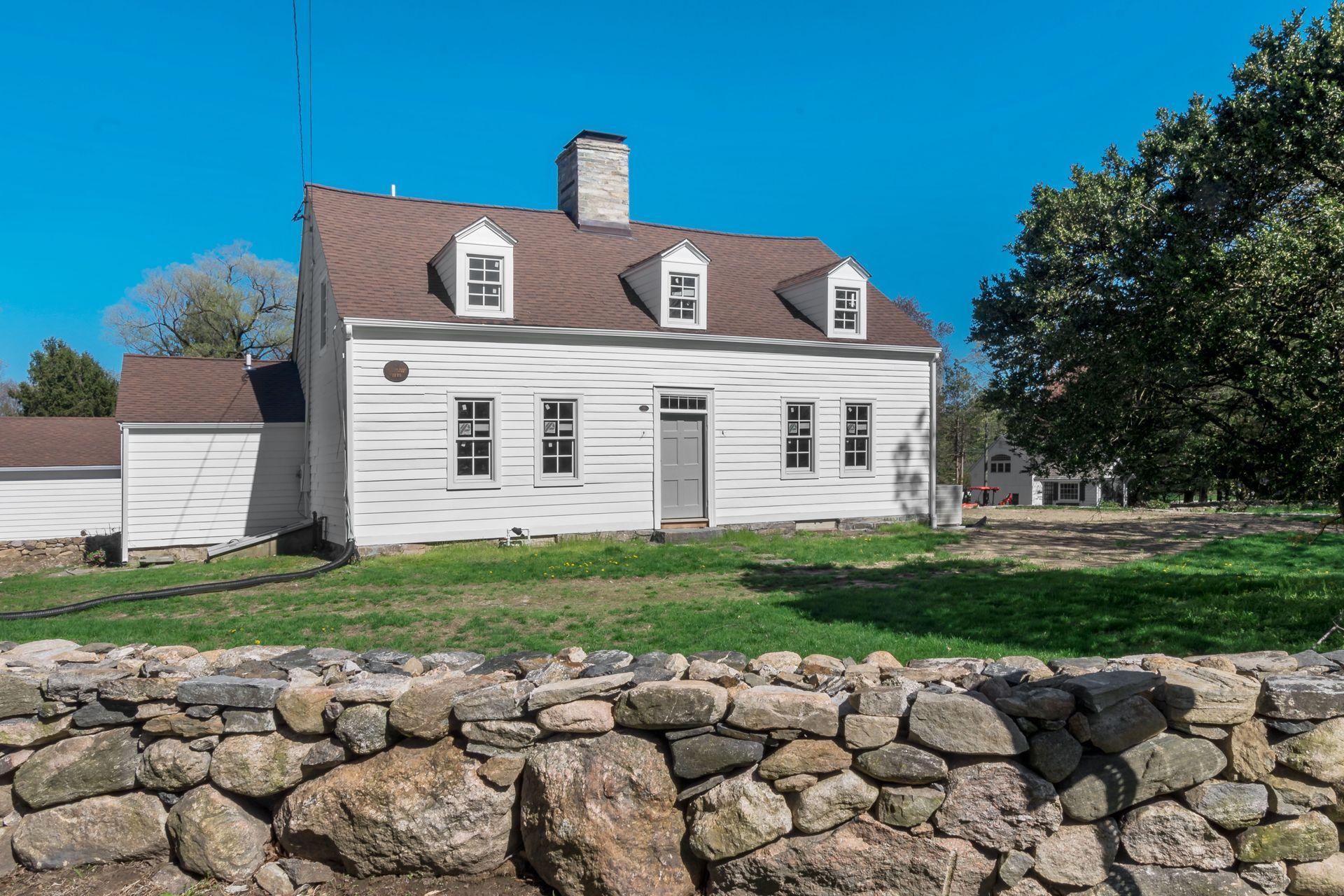 129 Davenport Ridge Road Stamford, CT 06903 - Photo 3 of 43 a view of a house with a yard
