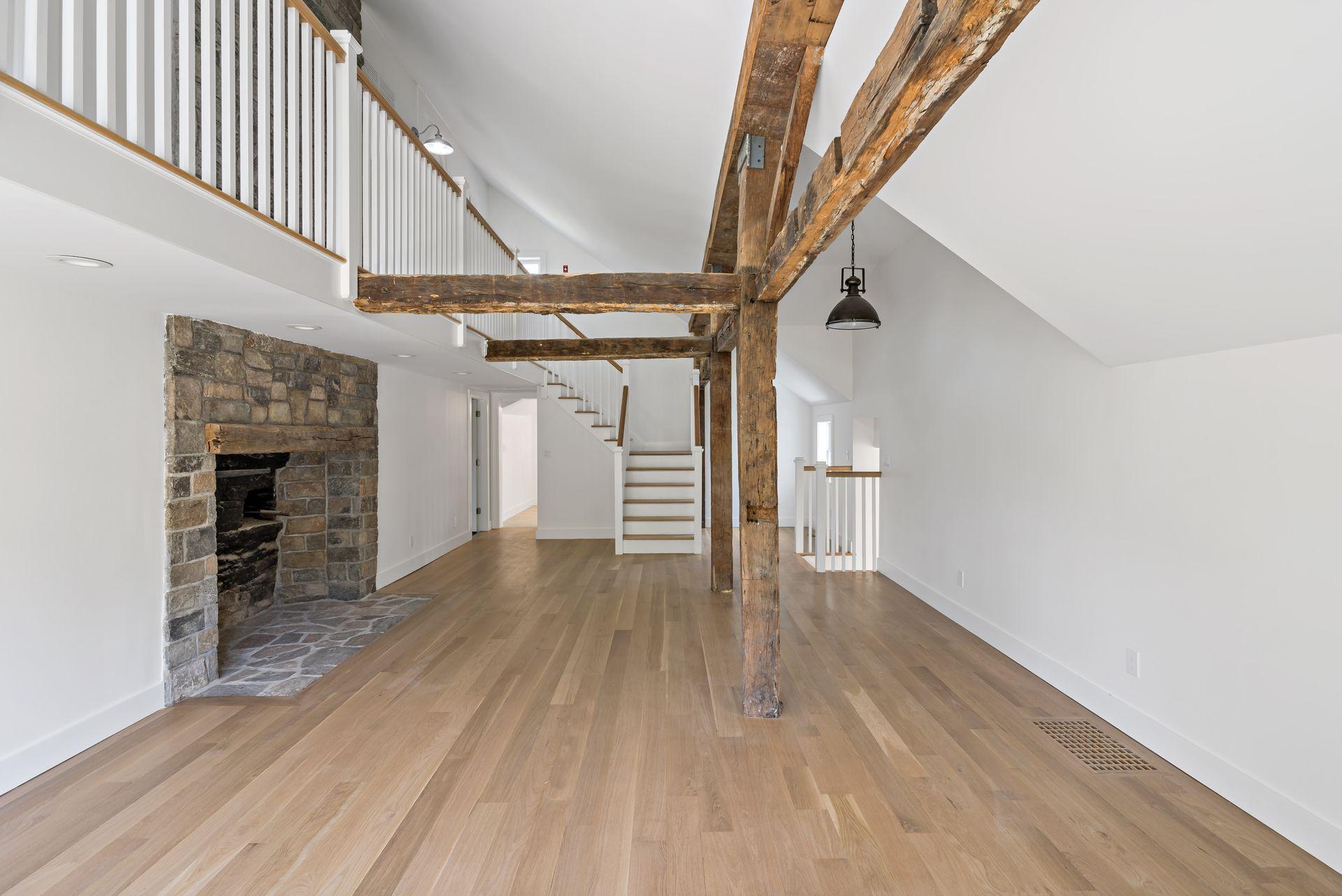 129 Davenport Ridge Road Stamford, CT 06903 - Photo 5 of 43 a view of empty room with wooden floor and stairs