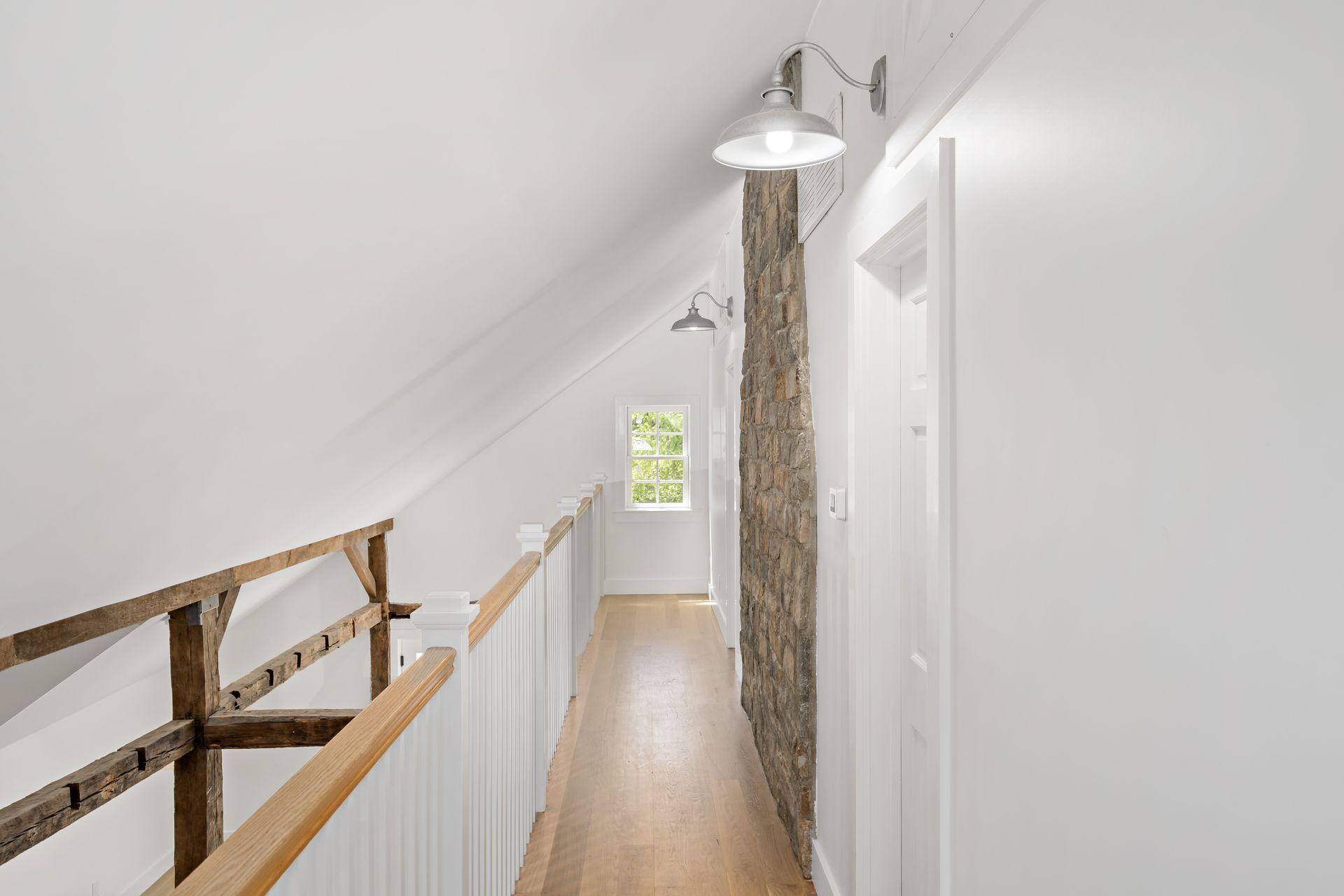 129 Davenport Ridge Road Stamford, CT 06903 - Photo 7 of 43 a view of a hallway with wooden floor and staircase