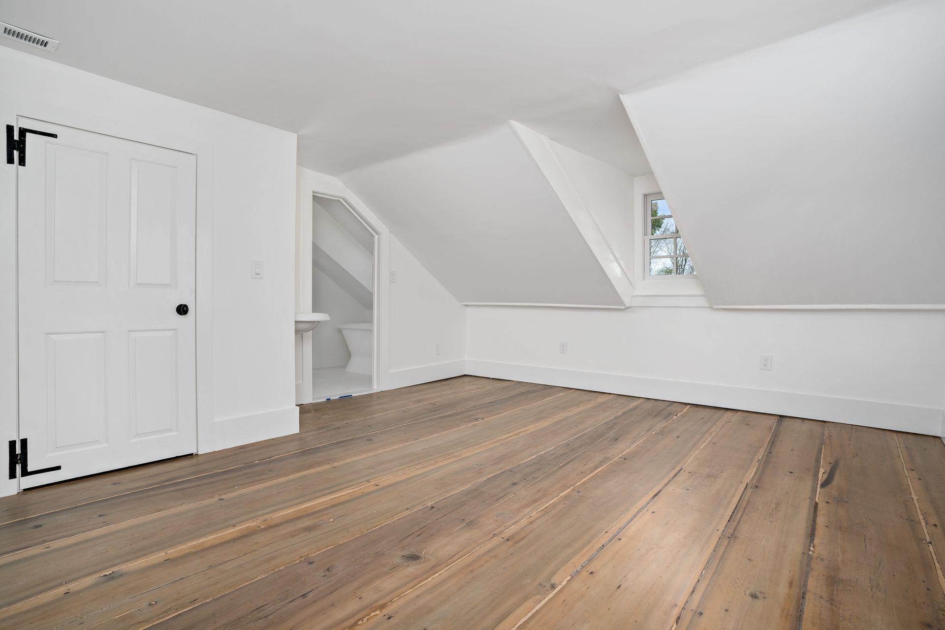 129 Davenport Ridge Road Stamford, CT 06903 - Photo 8 of 43 a view of an empty room with wooden floor and entryway