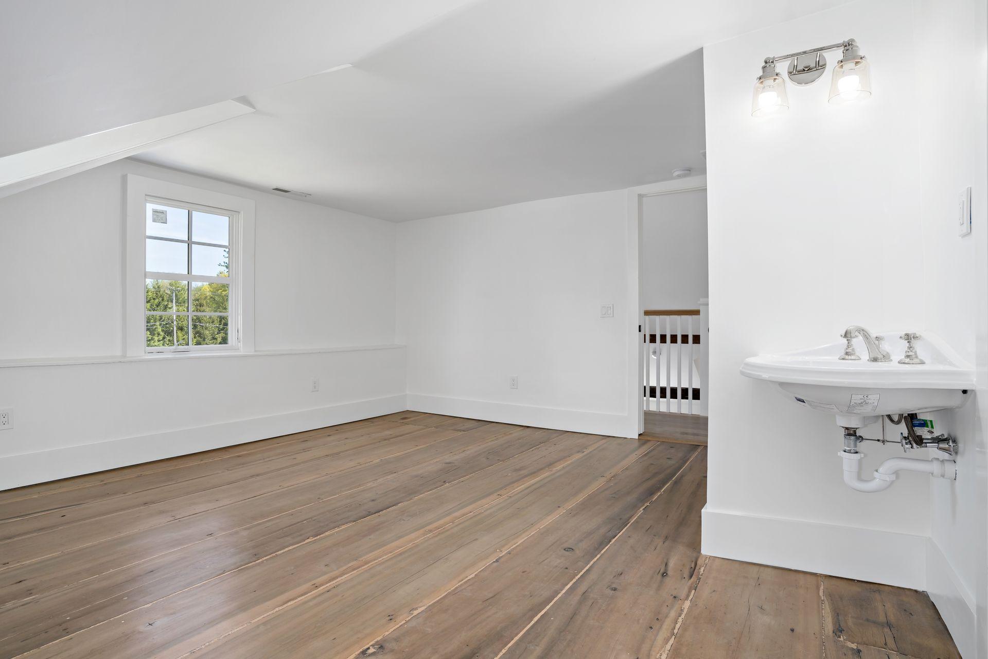 129 Davenport Ridge Road Stamford, CT 06903 - Photo 9 of 43 a bathroom with a sink and a window